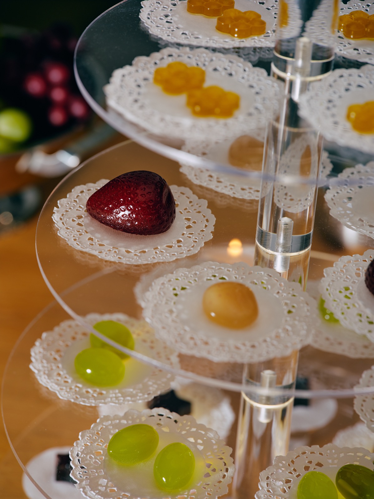 Handmade luxury gel candies on a tiered dessert display, premium candy catering by GEL NYC