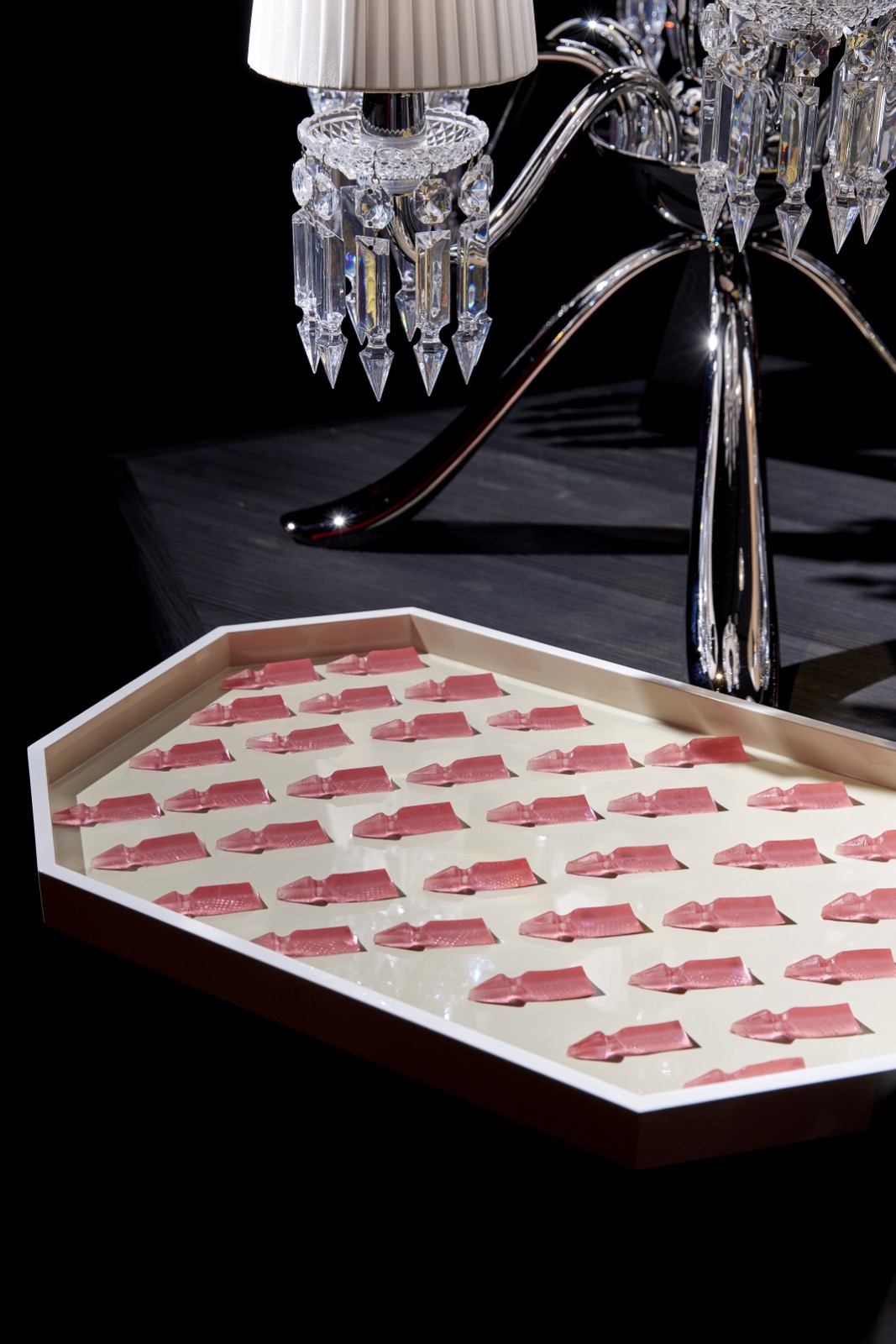 Luxury candy display beneath a crystal chandelier, GEL NYC x Baccarat fashion event